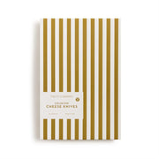 Pack of cheese knives with gold and white striped design on a white background