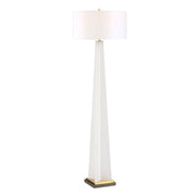 Tall floor lamp with a white shade on a white background