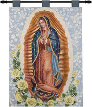 Tapestry of Our Lady of Guadalupe with floral design on a blue background