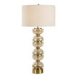 Uttermost Assemble Table Lamp Modern Amber Glass Stack with Brass Accents and White Linen Drum Shade for Elegant Interiors
