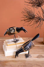 Set of 2 multicolor recycled metal and eucalyptus wood crow sculptures with distressed finish