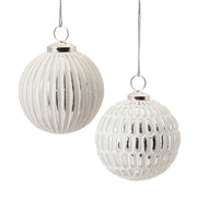 Christmas tree ornaments in frosted white and silver