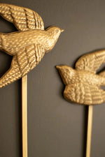 Painted metal sparrow wall sconce with antique gold finish for taper candles