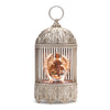 LED birdcage-style Nativity snow globe with Holy Family and angel, swirling glitter, 11 inches tall
