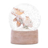 Beige snow globe featuring birds on a pine branch with swirling snow and a faux wood grain base, 4.5 inches tall