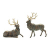 Two bronze deer figurines on a white background