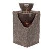 Stone-like water fountain with two bowls on a white background