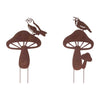 Whimsical mushroom garden stake with perched bird detail
