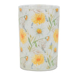 Candle with floral design on a white background