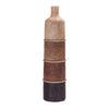 Decorative vase with layered wooden segments and rope on a white background