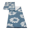 Blue and white patterned fabric on a white background