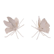 Pair of white butterfly-shaped earrings on a white background