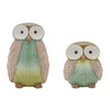 Two ceramic owl figurines with a gradient green and beige color scheme on a white background.