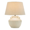 Table lamp with a beige ceramic base and a matching lampshade on a white background