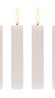 Battery-operated faux flame candles in a cozy living room setting

