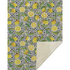 Patterned fabric with lemons and leaves on a geometric background
