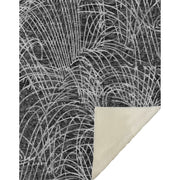 Rug with abstract leaf pattern on a white background