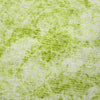 Close-up of a textured green fabric surface