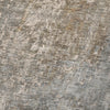 Close-up of a textured stone surface with gray and brown tones