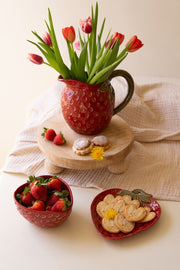 Small fruit-shaped ceramic pitcher in red strawberry design