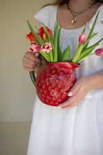 Red ceramic strawberry jug for kitchen display
