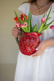 Red ceramic strawberry jug for kitchen display