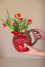 Strawberry themed ceramic pitcher with textured finish