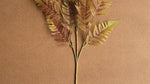Plastic and wire artificial fern branch