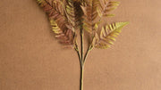 Plastic and wire artificial fern branch