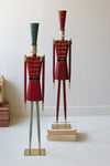 Set of two painted metal Christmas soldier figurines