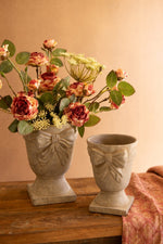 Set of Two Concrete Urns with Bow Detail – Grey Distressed Finish – Tabletop, Patio and Garden Decor by Kalalou