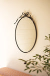 Kalalou 35.5"H Oval Mirror with Bow Detail – Matte Black