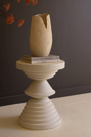 White pedestal-style accent table