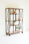 Iron and wood display shelf with alternating tiers and casters