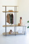 Clothing rack with staggered recycled wood shelving