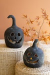 Large and small jack-o-lanterns black clay
