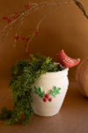Festive holiday vase with perched red bird and painted holly
