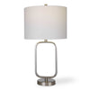 Table lamp with a white shade and metallic base on a white background