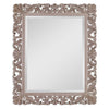 Decorative mirror with intricate floral frame on a white background