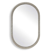 Oval mirror with a textured silver frame on a white background