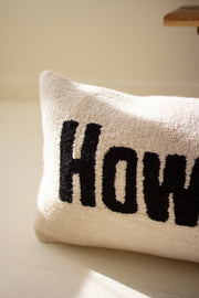 Textured hooked Howdy pillow close-up