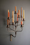 Iron wall candelabra with thirteen taper candle holders