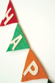 Colorful felt banner with letters 'X', 'A', and 'P' on a white background