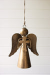 Bronze angel ornament hanging against a white background