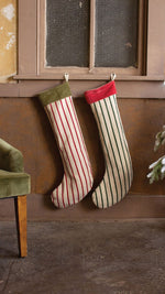 Kalalou velvet-collared Christmas stockings hanging on mantel