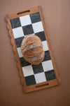 checkered acacia and marble serving board
