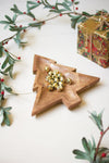 Carved wooden Christmas tree platter on holiday table