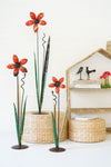 Set of three tall recycled iron flower sculptures