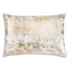 Decorative pillow with gold and white abstract pattern on a white background