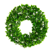 Green leafy wreath with small white flowers on a white background